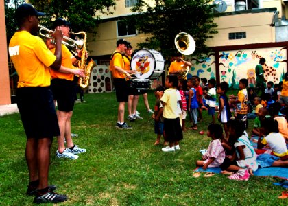 US Navy 100517-N-3446M-202 U.S. 7th Fleet Band ensemble, Orient Express, perform a concert as the children from the Fountain of Life Children's Center dance