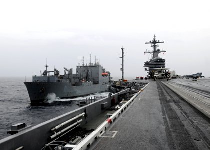 US Navy 100518-N-3885H-029 USS George H.W. Bush (CVN 77) is underway alongside USNS Lewis and Clark (T-AKE 1) before an underway replenishment