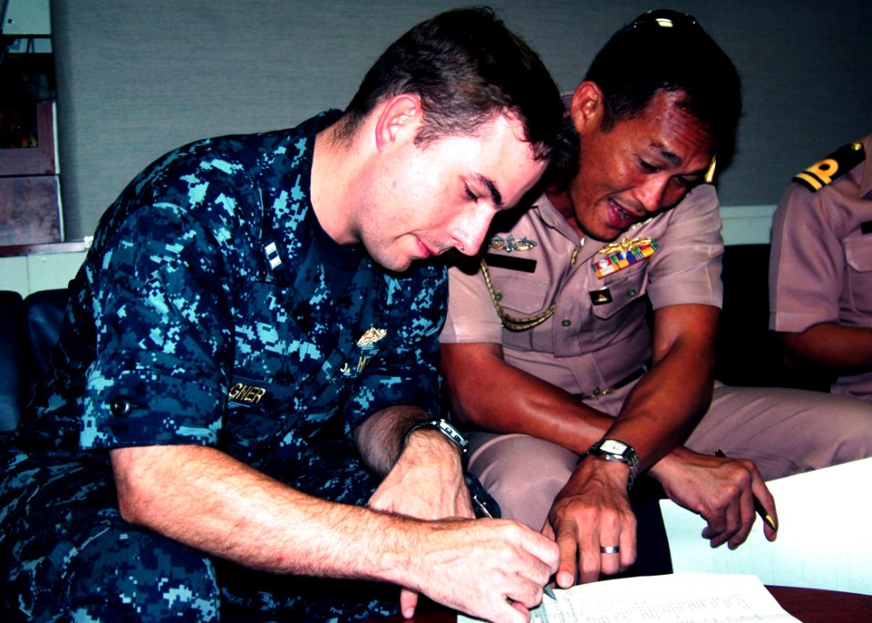 US Navy 100513-N-3446M-058 Lt. Nicholas Wagner discusses upcoming events with his Royal Thai Navy counterpart for Cooperation Afloat Readiness and Training Thailand 2010