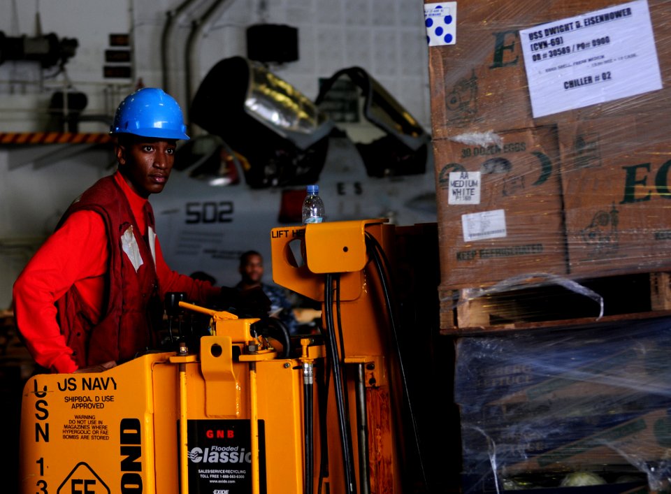 US Navy 100513-N-4236E-078 Aviation Ordnanceman Airman Desmon Rogers operates a forklift during a replenishment at sea aboard the aircraft carrier USS Dwight D. Eisenhower (CVN 69)