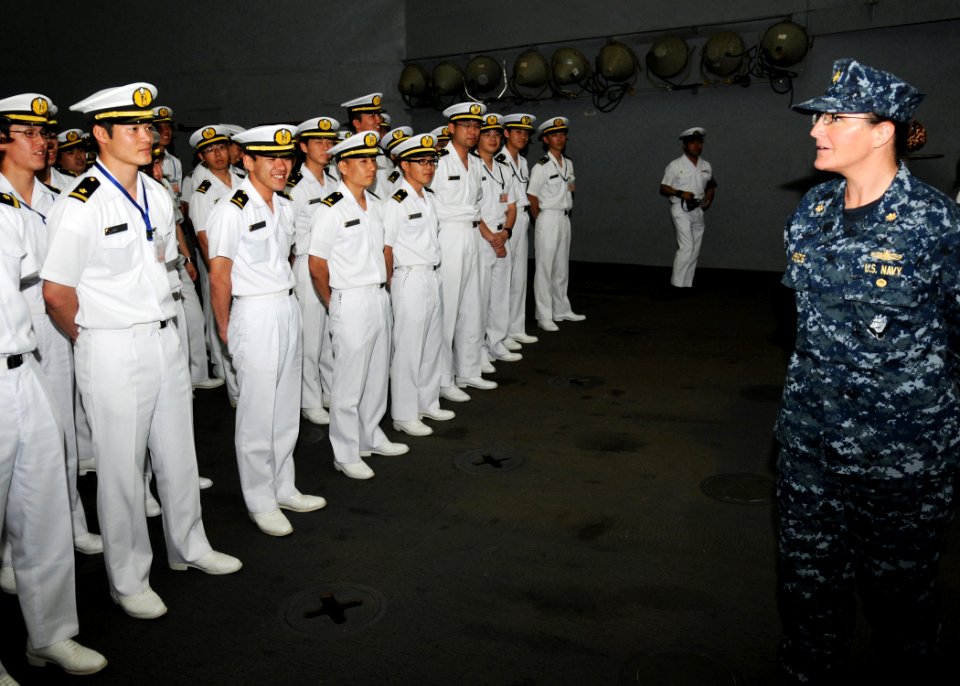 US Navy 100518-N-8721D-001 t. Cmdr. Carol McKenzie, executive officer of the amphibious dock landing ship USS Harpers Ferry (LSD 49) welcomes Japan Maritime Self-Defense Force ensigns aboard the ship for a tour