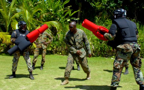US Navy 100513-N-4971L-416 U.S. Marine Corps Sgt. Geormon Elder, from Atlanta, embarked aboard High Speed Vessel Swift (HSV 2), referees a sparring match between two members of the Jamaican Defence Force in Port Antonio, Jamaic photo
