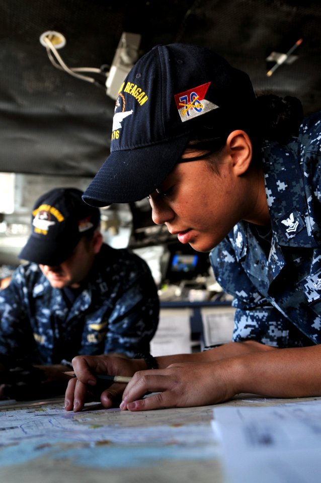 US Navy 100518-N-9132C-089 Quarter Master 2nd Class Melissa Pate plots a course as USS Ronald Reagan (CVN 76) pulls out of San Diego Harbor