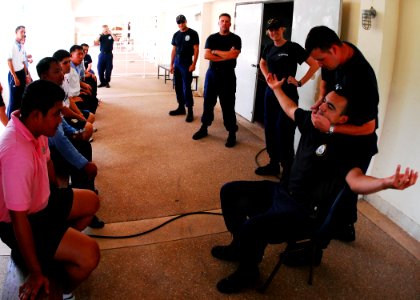 US Navy 100514-N-0995C-120 U.S. Coast Guardsmen assigned to the U.S. Coast Guard cutter Mellon (WHEC 717) instruct Royal Thai Navy sailors how to apply pressure to pressure points