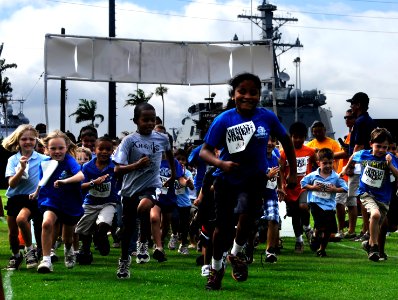US Navy 100519-N-7498L-053 Children from the Morale, Welfare and Recreation (MWR) Youth Sports Program at Commander, Navy Region Hawaii, participate in a 1.5-mile fun run