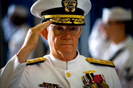 US Navy 100514-N-0807W-379 Vice Adm. H. Denby Starling II, former commander of Navy Cyber Forces and Naval Network Warfare Command salutes while being piped ashore photo