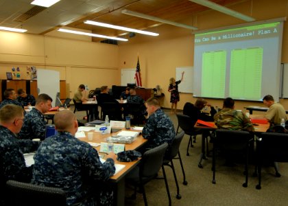 US Navy 100514-N-9520G-003 ailors from various commands at Naval Air Station Whidbey Island listen as Kathleen Johnson, a financial educator, goes over savings records
