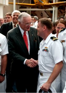 US Navy 100514-N-3852A-004 Former astronaut Neil Armstrong is congratulated by Lt. Gavin Clough, from San Diego, Calif. after Armstrong's induction to the Naval Aviation Hall of Honor in Pensacola, Fla
