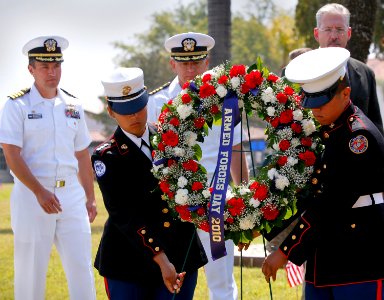 US Navy 100515-N-8863V-331 Sailors and JROTC students place a wreath honoring fallen service members during the inaugural Inland Empire Armed Forces Day event at NSWC Corona