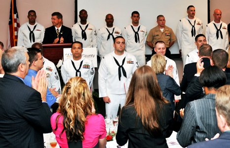 US Navy 100521-N-0486G-012 Local members of the military are applauded after receiving awards during the 2010 Clay County Chamber of Commerce Military Appreciation Luncheon photo