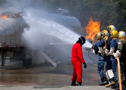 US Navy 100518-N-9520G-002 Sailors from various commands combat a simulated flight deck fire during a flight deck fire fighting course at the Center for Naval Aviation Technical Training Unit Whidbey Island