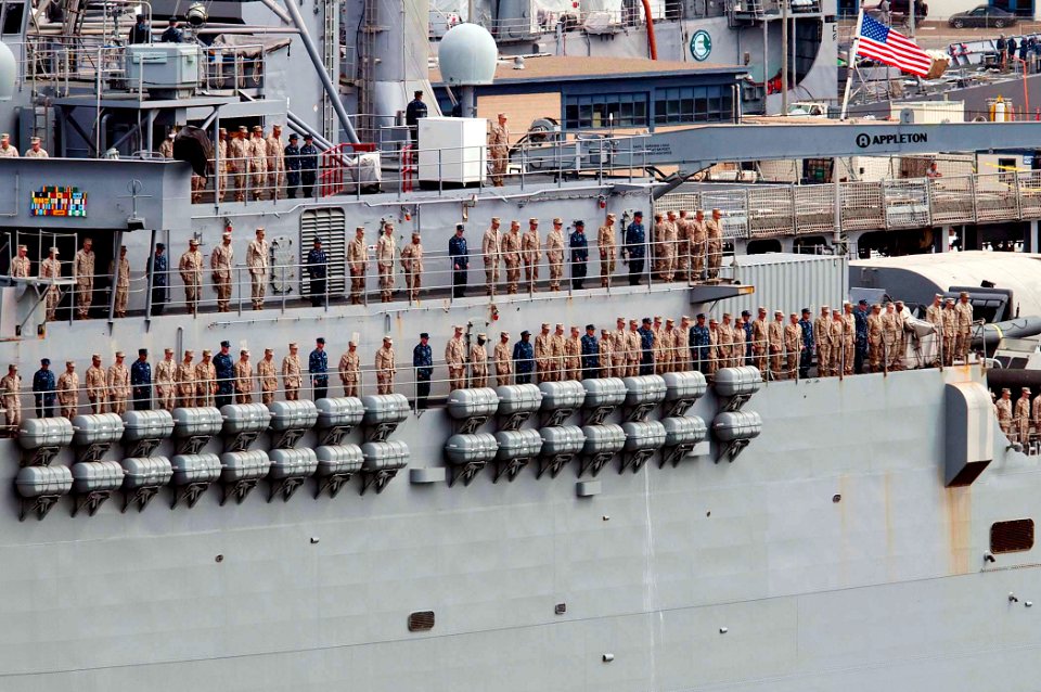 US Navy 100518-N-7948R-115 Sailors and Marines man the rails as the amphibious transport dock ship USS Dubuque (LPD 8) departs San Diego for a 2010 deployment to the western Pacific Ocean