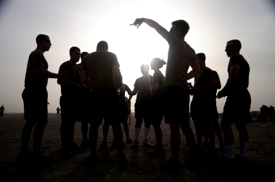 US Navy 100522-N-0475R-704 Seabees and Marines play a softball game at Camp Leatherneck, Afghanistan