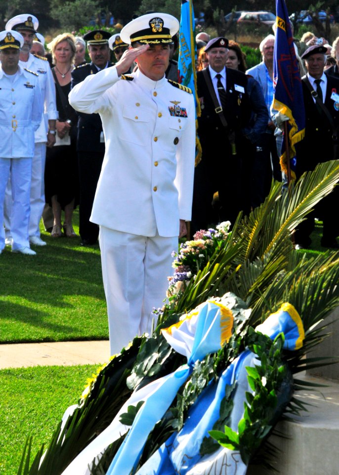 US Navy 100522-N-0780F-001 Capt. Thomas J. McDonough, commanding officer of U.S. Naval Support Activity Souda Bay, renders a salute after laying a wreath at the Allied War Cemetery of Souda