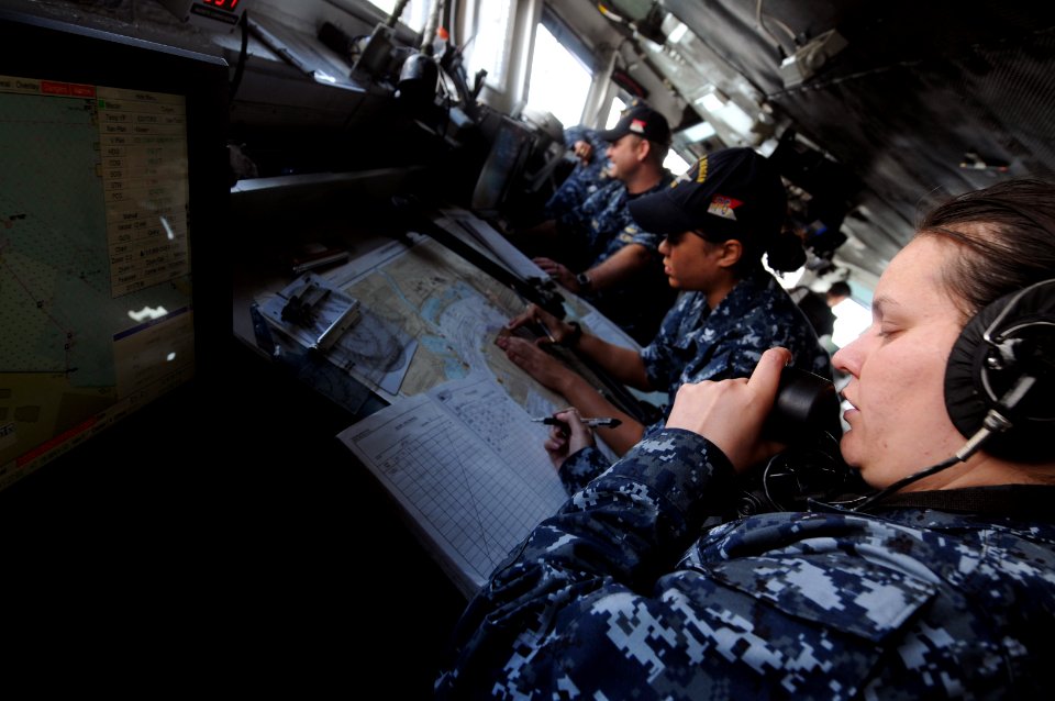 US Navy 100518-N-9132C-082 Quarter Master 3rd Class Lorena Guzman records the bearings of USS Ronald Reagan (CVN 76)