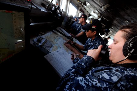 US Navy 100518-N-9132C-082 Quarter Master 3rd Class Lorena Guzman records the bearings of USS Ronald Reagan (CVN 76)