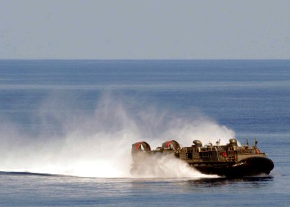 US Navy 100521-N-1082Z-021 Landing Craft Air Cushion (LCAC) 77, assigned to Assault Craft Unit (ACU) 4, transports personnel and equipment to the amphibious dock landing ship USS Ashland (LSD 48) photo