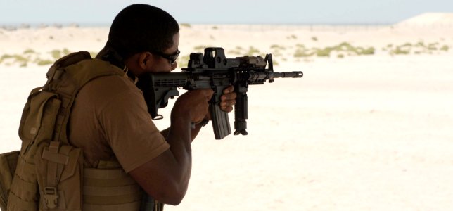 US Navy 100519-N-4776G-225 Mass Communication Specialist 1st Class Herbert Banks practices dry firing his M-4 service rifle at Shank-Sa Weapons Range