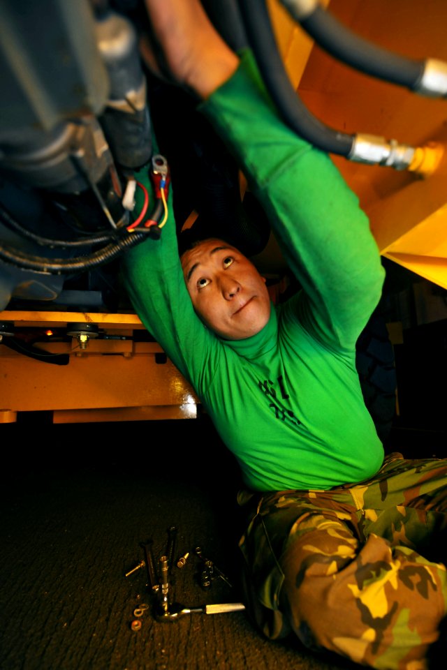 US Navy 100519-N-4516G-010 Aviation Support Equipment Technician Airman Hyon J. Kim changes the starter of a 20K forklift aboard the aircraft carrier USS Enterprise (CVN 65)