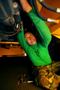 US Navy 100519-N-4516G-010 Aviation Support Equipment Technician Airman Hyon J. Kim changes the starter of a 20K forklift aboard the aircraft carrier USS Enterprise (CVN 65)
