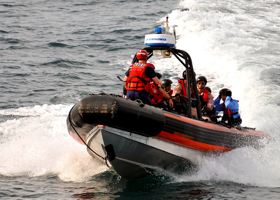 US Navy 100519-N-7643B-150 U.S Coast Guardsmen speak with Royal Thai Navy sailors before approaching the U.S. Coast Guard cutter Mellon (WHEC 717)