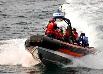 US Navy 100519-N-7643B-150 U.S Coast Guardsmen speak with Royal Thai Navy sailors before approaching the U.S. Coast Guard cutter Mellon (WHEC 717)