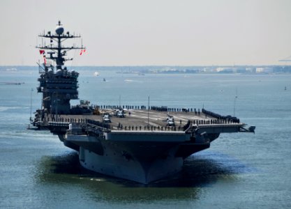 US Navy 100521-N-6003P-034 Sailors and Marines man the rails aboard the Nimitz-class aircraft carrier USS Harry S. Truman (CVN 75) as the ship departs for a scheduled deployment