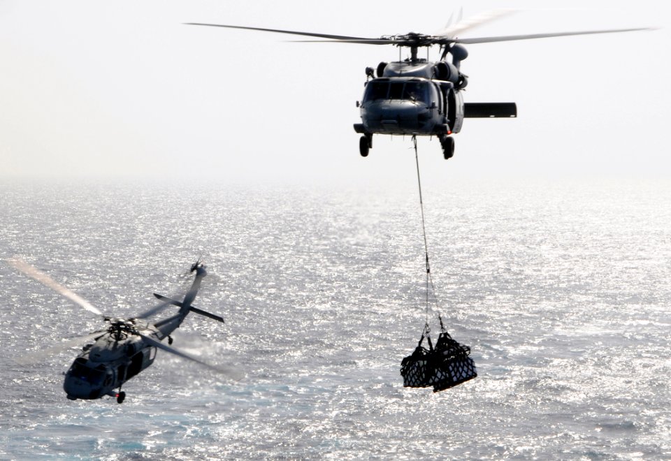 US Navy 100520-N-4236E-216 Two MH-60S Sea Hawk helicopters assigned to the Chargers of Helicopter Sea Combat Squadron (HSC) 26 conduct a vertical replenishment