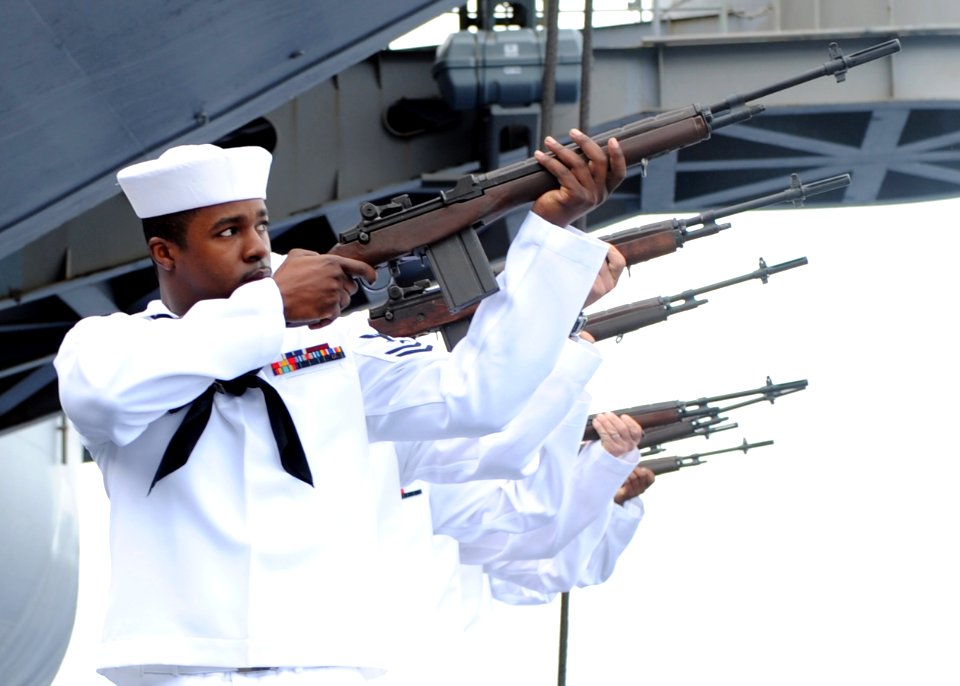US Navy 100524-N-3620B-036 Gunner's mates render honors to 10 Navy veterans during a burial at sea ceremony aboard the aircraft carrier USS Enterprise (CVN 65)