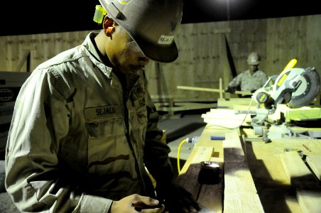 US Navy 100522-N-0475R-007 Construction Electrician 3rd Class Stanley Sejalbo, from Ewa Beach, Hawaii, assigned to Naval Mobile Construction Battalion (NMCB) 5 lays stud measurements for outlets at a project at Camp Leatherneck