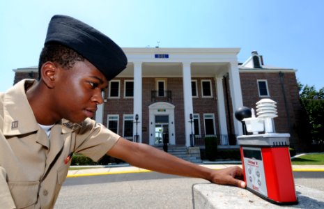 US Navy 100524-N-5328N-671 Cryptologic Technician (Technical) Seaman Antron Johnson-Gray checks the wet bulb globe temperature meter