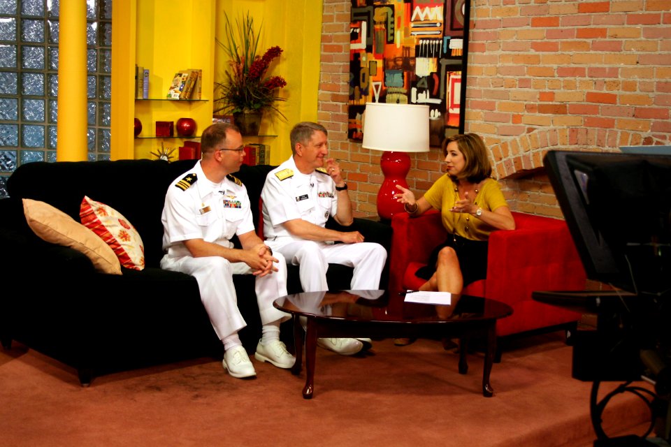 US Navy 100524-N-6220J-014 KATV-TV news reporter Melinda Mayo interviews Rear Adm. Raymond P. English and Lt. Cmdr. Mike Weyenberg about the schedule of events of Little Rock Navy Week 2010