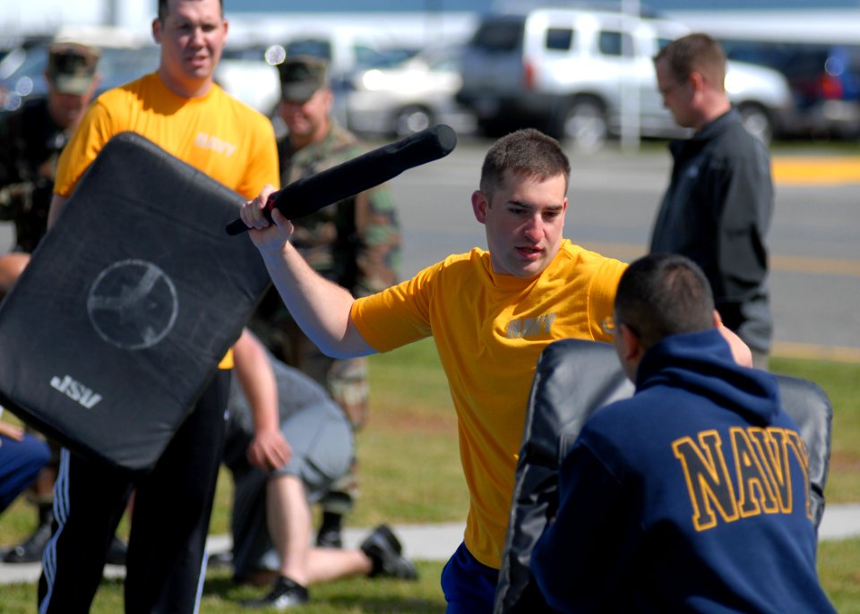 US Navy 100520-N-9520G-001 Aviation Structural Mechanic 3rd Class Wayne Groves uses a baton to defend himself against a simulated attacker during a security reactionary force-basic course at Naval Air Station Whidbey Island