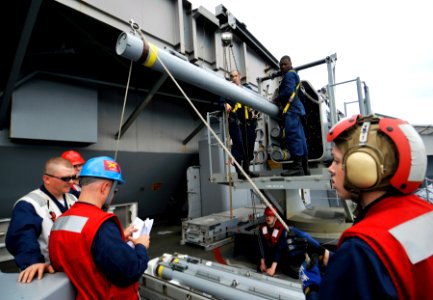 US Navy 100524-N-6003P-081 Sailors load a Rolling Airframe Missile (RAM) aboard the Nimitz-class aircraft carrier USS Harry S. Truman (CVN 75)