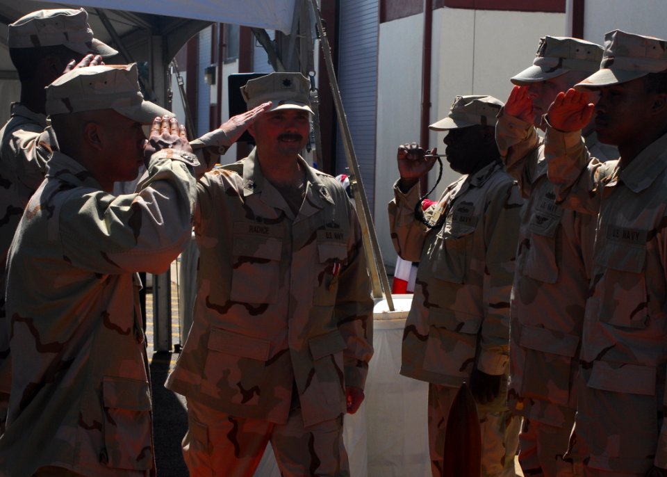 US Navy 100521-N-3165S-062 Cmdr. Richard Radice salutes the side boys following a change of command ceremony at Joint Expeditionary Base Little Creek-Fort Story