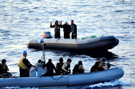 US Navy 100525-N-0000X-003 Boaters agree to a consensual boarding of their ridged-hull inflatable boat by a visit, board, search and seizure team from the guided-missile frigate USS Elrod (FFG 55)