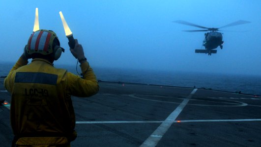 US Navy 100525-N-0864H-289 Seaman Drew Iverson lands an SH-60F Sea Hawk helicopter aboard the U.S. 7th Fleet command ship USS Blue Ridge (LCC 19)