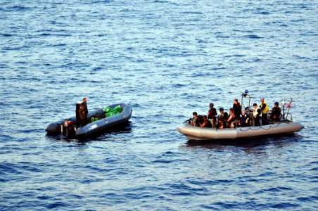 US Navy 100525-N-0000X-002 Boaters agree to a consensual boarding of their ridged-hull inflatable boat by a visit, board, search and seizure team from the guided-missile frigate USS Elrod (FFG 55) to verify the vessel's registr
