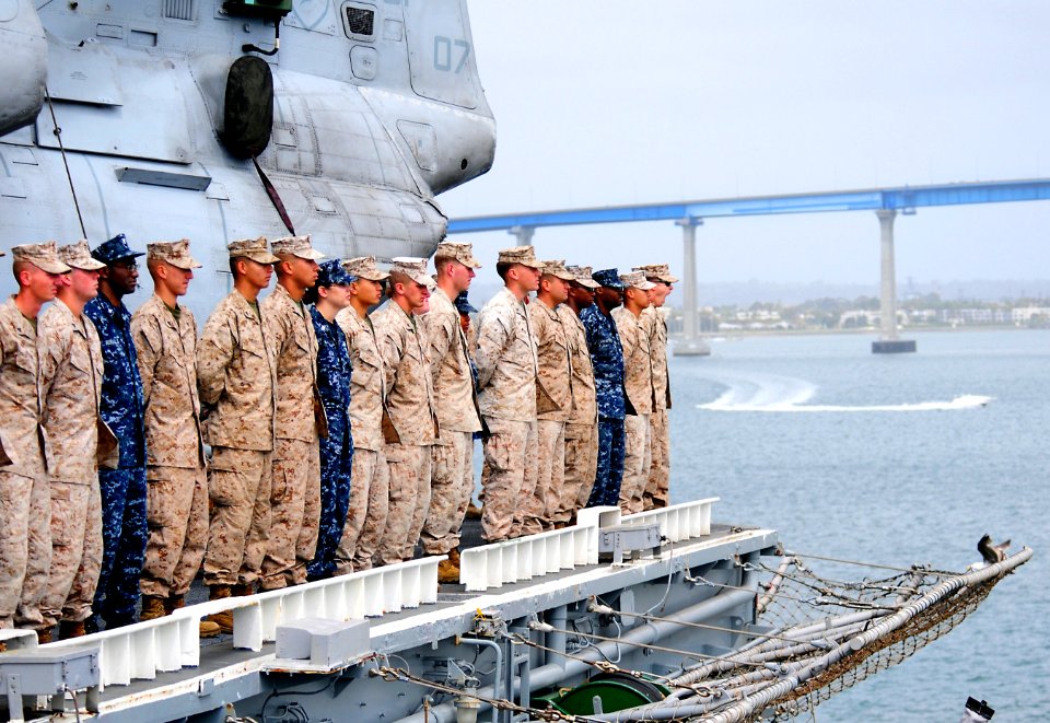 US Navy 100522-N-7948R-317 Sailors and Marines man the rails aboard USS Peleliu (LHA 5) as the ship departs San Diego for a scheduled deployment