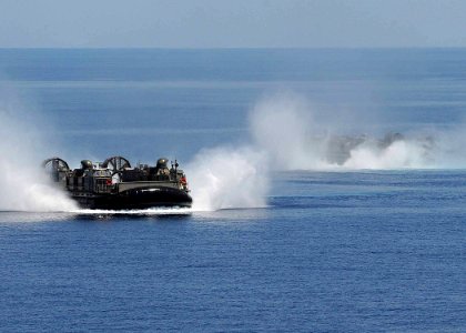 US Navy 100521-N-1082Z-030 Landing Craft Air Cushions (LCAC) 77 and 67 cross paths enroute to USS Ashland (LSD 48)