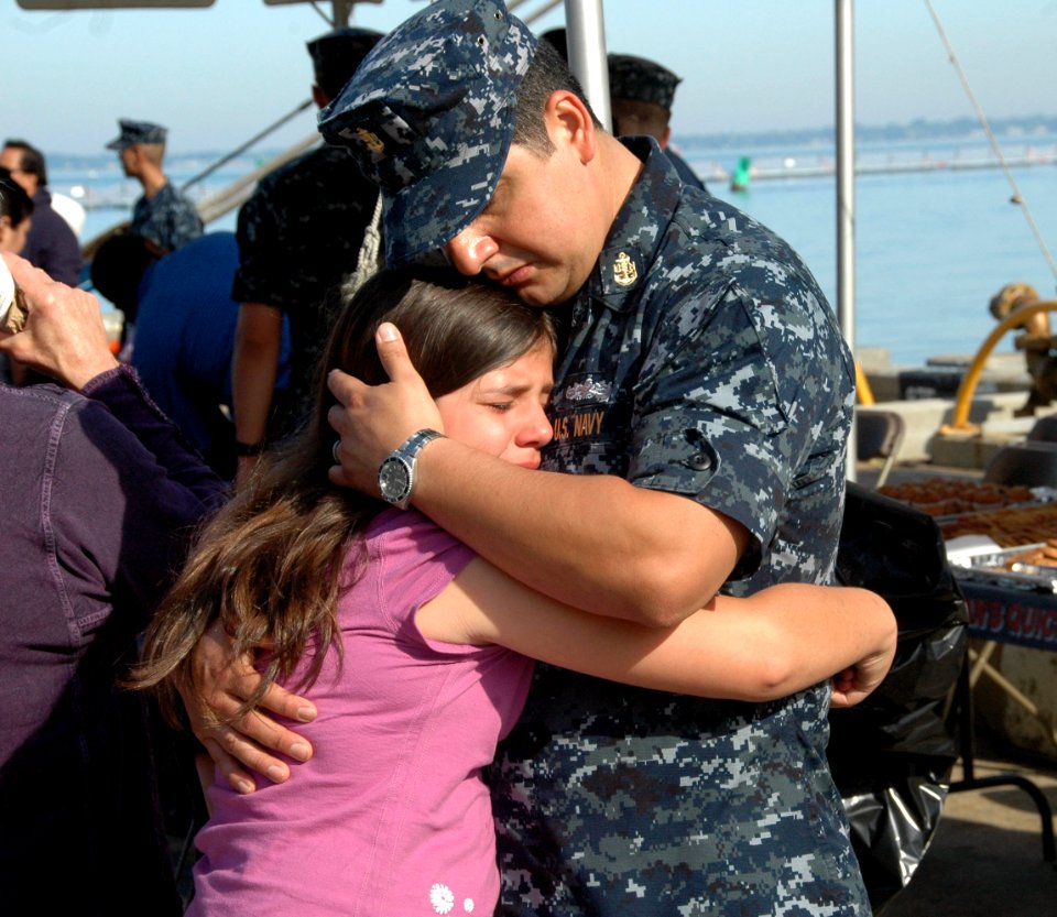 US Navy 100521-N-9806M-058 Chief Logistics Specialist Jose Rodriguez, assigned to the Nimitz-class aircraft carrier USS Harry S. Truman (CVN 75), says goodbye to his daughter before the ship departs Naval Station Norfolk