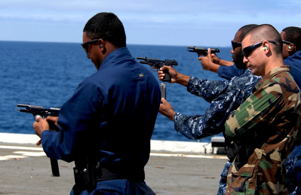 US Navy 100525-N-6477M-066 ailors conduct small arms weapons qualifications with the 9mm Baretta aboard the amphibious transport dock ship USS Cleveland (LPD 7) during marine expeditionary amphibious exercise Dawn Blitz
