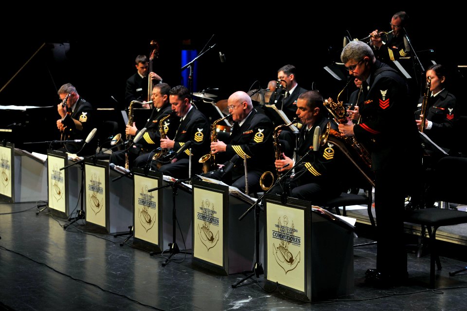 US Navy 100522-N-0773H-012 Musician 1st Class Rob Holmes, right, performs on baritone saxophone during the Commodores 40th Anniversary Concert at the George Mason University Center for the Arts in Fairfax, Va