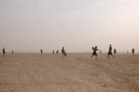 US Navy 100522-N-0475R-448 Seabees and Marines play a softball game at Camp Leatherneck, Afghanistan