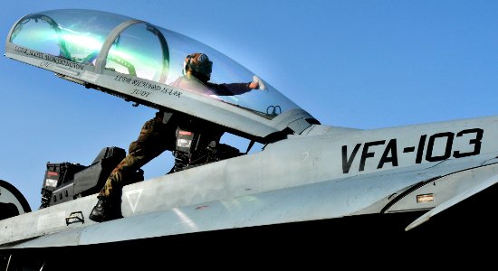 US Navy 100524-N-3595W-002 A Sailor assigned to the Jolly Rogers of Strike Fighter Squadron (VFA) 103 cleans the windows on an FA-18F Super Hornet aboard the Nimitz-class aircraft carrier USS Dwight D. Eisenhower (CVN 69)