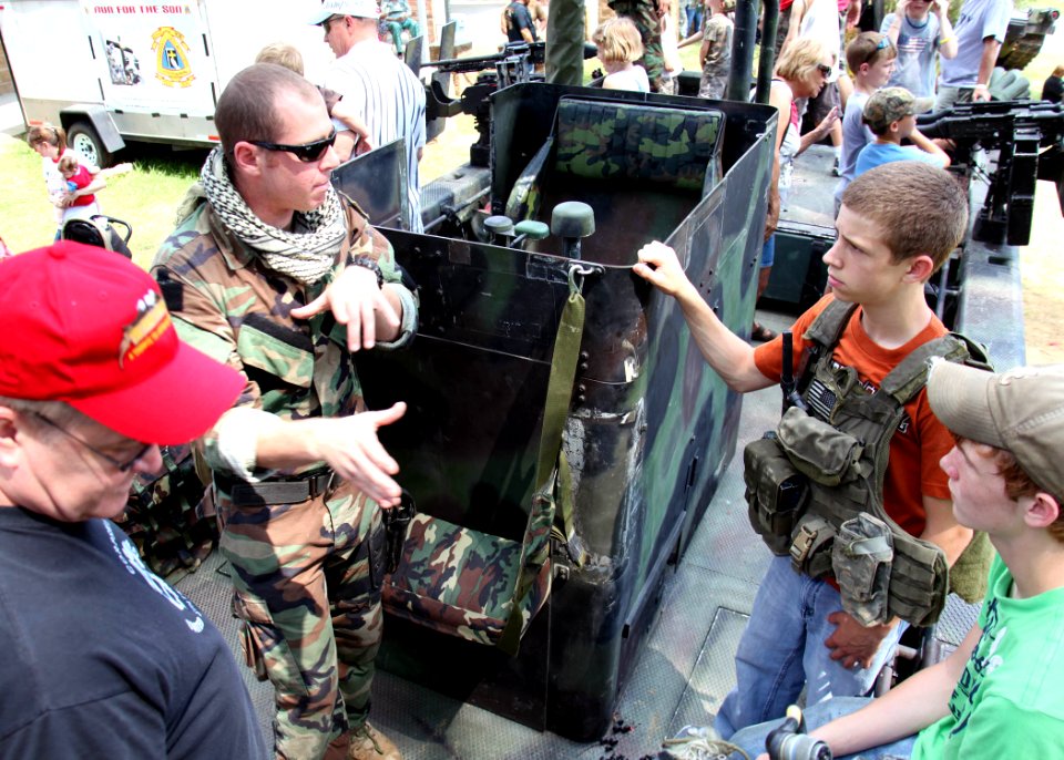 US Navy 100522-N-4205W-006 A special warfare combatant-craft crewmen assigned to Special Boat Team 22 explains the weapons aboard the special operations craft Riverine during the annual Trail of Honor