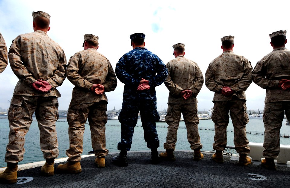 US Navy 100522-N-7948R-285 Sailors and Marines man the rails aboard USS Peleliu (LHA 5) as the ship departs San Diego for a scheduled deployment