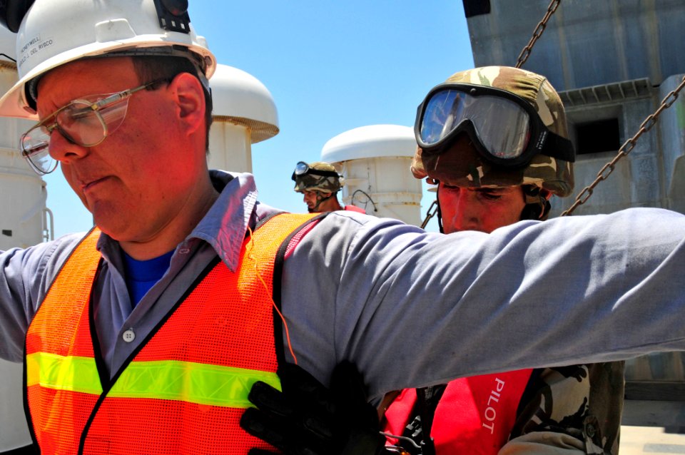 US Navy 100526-N-7364R-366 A Spanish navy visit, board, search and seizure team member searches a crewmember aboard the Military Sealift Command