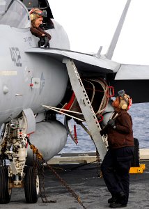 US Navy 100522-N-3885H-061 Sailors assigned to Strike Fighter Squadron (VFA) 87 talk on the flight deck before flight operations aboard the aircraft carrier USS George H.W. Bush (CVN 77)