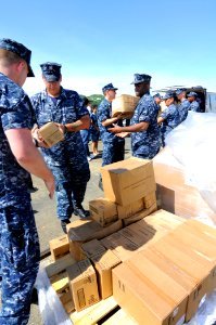US Navy 100526-N-9643W-227 Sailors assigned to High Speed Vessel Swift (HSV 2) load Project Handclasp donations into vehicles on the pier for several organizations in Panama City, Panama
